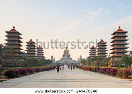 Kaohsiung, Taiwan - December 15, 2014: Sunset at Fo Guang Shan buddist temple of Kaohsiung, Taiwan with many tourists walking by.