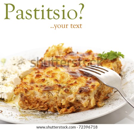 Pastitsio & feta cheese in a plate, greek traditional food, on white background