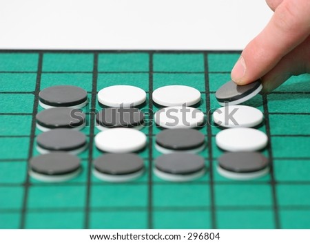 Game of Othello, laying the winning piece