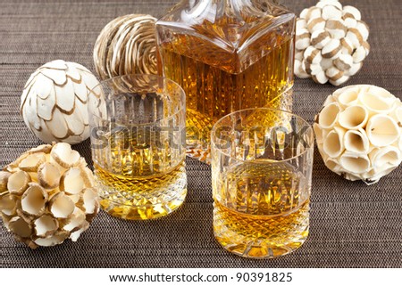 Fine scotch whisky in crystal bottle and tumbler glasses with stylish spheres