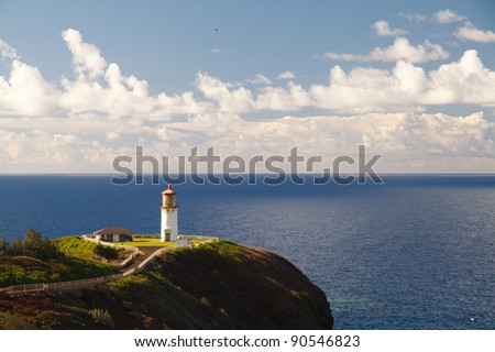 Kilauea lighthouse northern guide in Kauai island with calm ocean in background