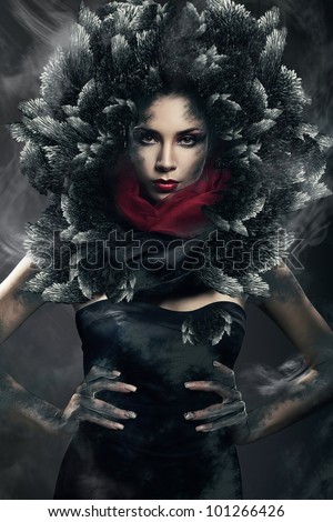 hot mysterious woman in black hood in dust