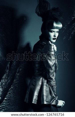 black and white woman in jacket with black bow
