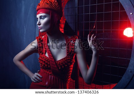 passion hot woman in red dress and light