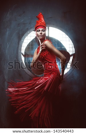 passion woman in red dress in circle of light