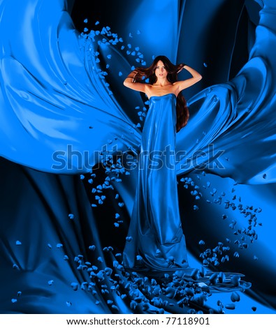 goddess of love in long blue dress with magnificent long hair makes a magic ritual of connecting hearts of people on blue drapery, fabric