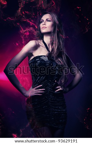 sexy woman in black dress in violet lights