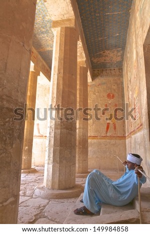 LUXOR, EGYPT-JUN 18:Guard seat at side court of awesome temple Queen Hatshepsut, between the Valley of Kings and the Valley of Queens in Luxor (Ancient Thebes) at June 18, 2011. Egypt.