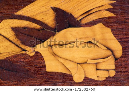 Wood texture and wooden rose on a sculpted jewelry box