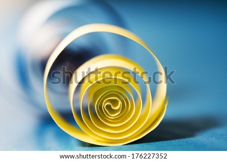 Macro, abstract, background picture of colored paper spirals on paper background