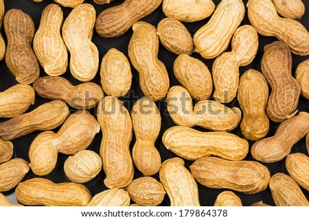 Peanuts in shell with black background  texture