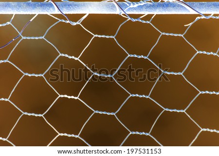 Woven rusty wire fence - texture with inverted colors