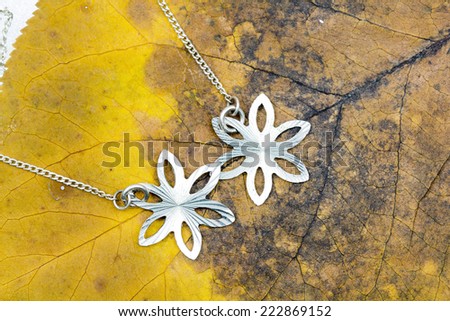 Silver jewels with autumn leaf texture