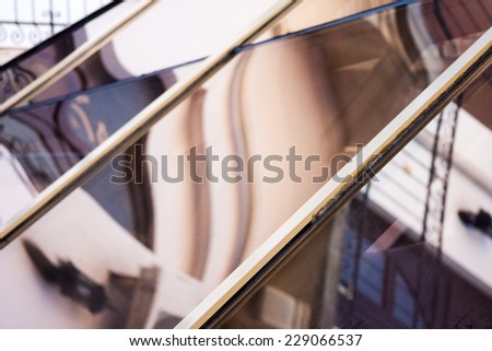 Abstract composition with glass and architecture details reflected and distorted. Image has grain texture visible on maximum size