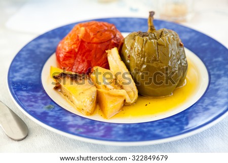 Stuffed vegetables and sauce on a blue plate