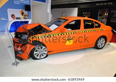 PARIS - OCTOBER 12: Crash test with a BMW displayed at the 2010 Paris Motor Show on October 12, 2010 in Paris.