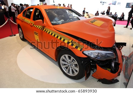 PARIS - OCTOBER 12: Crash test with a BMW displayed at the 2010 Paris Motor Show on October 12, 2010 in Paris.
