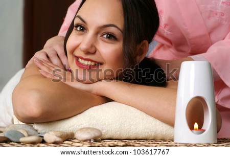 Happy Caucasian lady at a reception in the spa salon