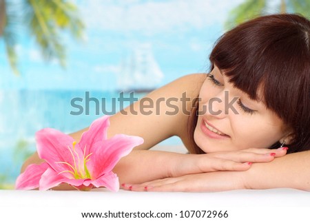 Lovely brunette is resting at a resort near the sea