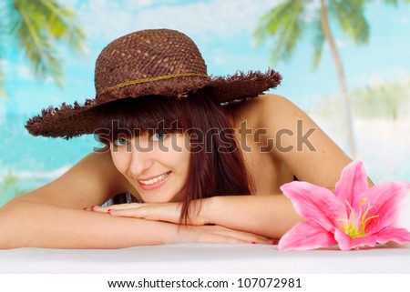 Nice brunette is resting at a resort near the sea