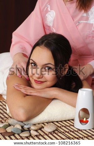 Good Caucasian lady at a reception in the spa salon
