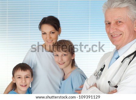 Happy family with children go to the doctor
