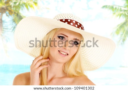 Nice blonde with a bright appearance is resting at a resort