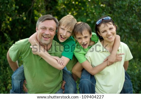Funny family having fun in the company of each other on the nature
