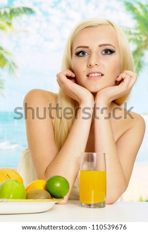 Pleasant blonde with a bright appearance is resting at a resort
