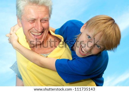 Fun family outdoors on blue sky background