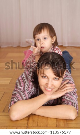 Little girl is resting at home with mom