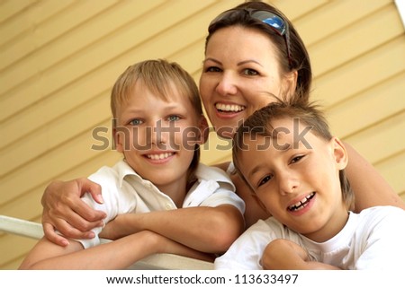 Beautiful woman having a good time in the company of her children