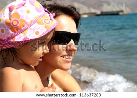 Cheerful family came to the beach to relax sea