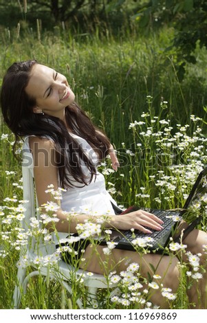 girl with a laptop on the nature
