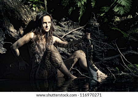 Wild woman posing with a loincloth on the nature