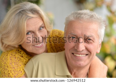 Portrait of a nice elderly couple posing in the room