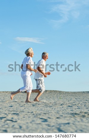 loving elder couple on a background of clear sky