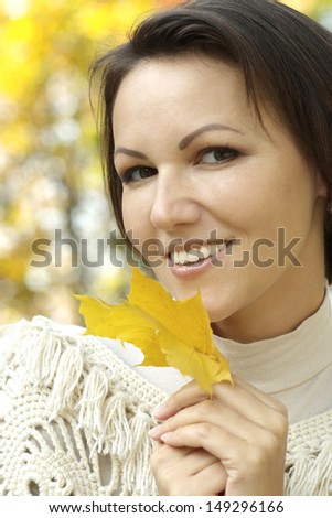 happy young woman on walk in autumn park