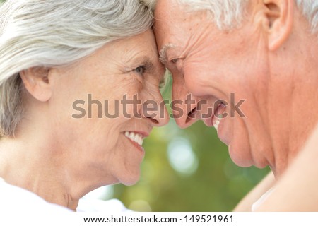 loving elderly couple on a walk in a summer park