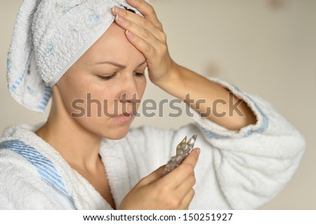 young woman in a white bathrobe sick with influenza