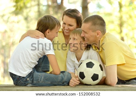Happy family and socker ball
