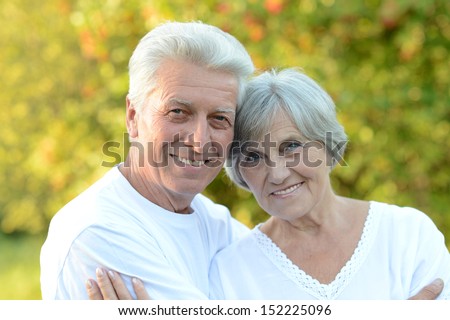 Portrait of a happy elder couple in the late spring outside