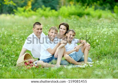 happy family on walk in the summer in good weather