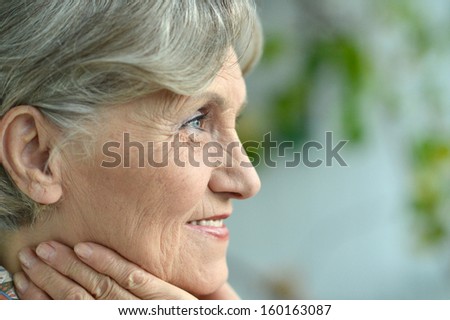 Portrait of an aged woman at home