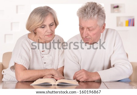 Elderly couple resting at home and enjoying each other\'s company