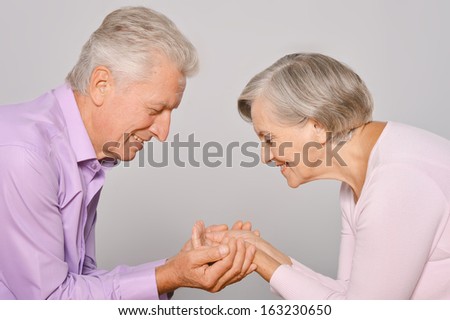 Happy older pair on a white background