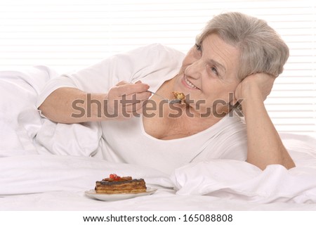 Beautiful older woman sleeping in the bedroom