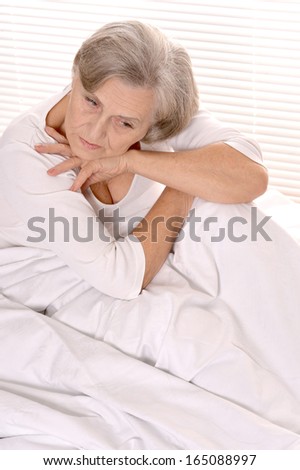 eautiful older woman resting in the bedroom
