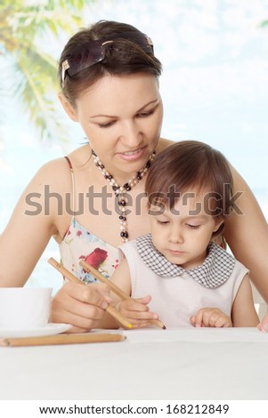 Portrait of a cute mom with her baby