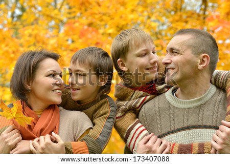 Pretty happy family for a walk in the park fall